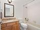 Cozy bathroom featuring a tub, shower, vanity, mirror, and a neutral color palette at 443 Garfield St, Denver, CO 80206