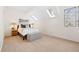 Bright bedroom with vaulted ceilings, skylights, and ample natural light at 443 Garfield St, Denver, CO 80206
