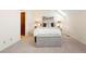 Spacious bedroom features a cozy bench and closet access at 443 Garfield St, Denver, CO 80206