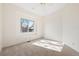 Inviting bedroom with neutral tones, a ceiling fan, and a window seat with backyard views at 443 Garfield St, Denver, CO 80206