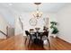 Dining area with hardwood floors, modern chandelier, and easy access to kitchen at 443 Garfield St, Denver, CO 80206