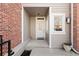 Welcoming front door with glass detail, surrounded by brick and siding accents at 443 Garfield St, Denver, CO 80206