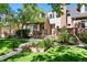 Charming two-story home featuring a manicured front lawn and attractive brick facade at 443 Garfield St, Denver, CO 80206