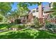 Beautiful home with a well-manicured lawn, professional landscaping, and a brick facade at 443 Garfield St, Denver, CO 80206