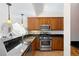 Updated kitchen features stainless steel appliances, granite countertops, and wood cabinets at 443 Garfield St, Denver, CO 80206