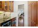 Kitchen features granite countertops, wine cooler, glass front cabinets and access to the living room at 443 Garfield St, Denver, CO 80206