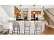 Kitchen with breakfast bar, wood cabinets, granite counters, and stainless steel appliances at 443 Garfield St, Denver, CO 80206