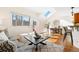 Bright living area with hardwood floors, skylight, and access to outdoor patio at 443 Garfield St, Denver, CO 80206