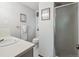 Bright bathroom featuring a walk-in shower and modern fixtures at 6898 W Nova Dr, Littleton, CO 80128