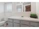 Clean bathroom with ample counter space and a window at 6898 W Nova Dr, Littleton, CO 80128