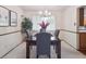 Dining room with a dark wood table and modern chandelier at 6898 W Nova Dr, Littleton, CO 80128