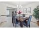 Formal dining room with elegant decor and a view into the adjacent living area at 6898 W Nova Dr, Littleton, CO 80128