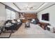 Inviting living room with a brick fireplace, built-in shelving and plush seating at 6898 W Nova Dr, Littleton, CO 80128