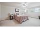 Bright bedroom with a ceiling fan and soft natural light at 6898 W Nova Dr, Littleton, CO 80128