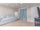 Finished basement with daybed and blue accents, great for relaxing or entertaining guests at 3186 W Indian Summer Ln, Castle Rock, CO 80109