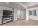 Finished basement space with neutral carpeting, recessed lighting, and access to a bathroom at 3186 W Indian Summer Ln, Castle Rock, CO 80109