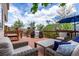 Deck with outdoor seating area and a grill, ideal for entertaining at 3186 W Indian Summer Ln, Castle Rock, CO 80109
