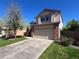 Well-maintained two-story home with a spacious driveway and manicured lawn at 3186 W Indian Summer Ln, Castle Rock, CO 80109