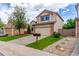 Two-story home featuring an attached two car garage and mature landscaping at 3186 W Indian Summer Ln, Castle Rock, CO 80109