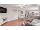 Spacious living area with hardwood floors, comfortable seating, and an open layout to the kitchen at 3186 W Indian Summer Ln, Castle Rock, CO 80109