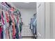 Spacious walk-in closet with ample storage and shelving for clothes and accessories at 3186 W Indian Summer Ln, Castle Rock, CO 80109