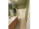 Cozy bathroom featuring a vanity, toilet, and shower-tub combo at 407 Ivory Cir, Aurora, CO 80011