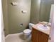 Bathroom featuring a vanity with a sink, toilet, and a mirror at 407 Ivory Cir, Aurora, CO 80011