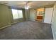 Spacious bedroom with neutral carpet, ceiling fan, and bright light from the windows at 407 Ivory Cir, Aurora, CO 80011