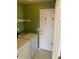 Laundry room with white washer and dryer next to a white door at 407 Ivory Cir, Aurora, CO 80011