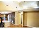 Open-concept living room with wood floors, and kitchen in the background at 407 Ivory Cir, Aurora, CO 80011