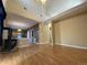 Spacious living room with hardwood floors, wood burning stove, and high ceilings at 407 Ivory Cir, Aurora, CO 80011