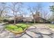 Community clubhouse surrounded by mature trees and green space at 2800 Kalmia Ave # C101, Boulder, CO 80301