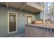 Unit entrance with wood trim window, door, and wooden flower box at 2800 Kalmia Ave # C101, Boulder, CO 80301