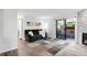 Bright living room with hardwood floors, comfortable seating, a sliding glass door, and modern decor at 2800 Kalmia Ave # C101, Boulder, CO 80301