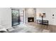 Contemporary living room with a stone fireplace, hardwood flooring, and sliding glass doors to a private patio at 2800 Kalmia Ave # C101, Boulder, CO 80301