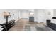 Bright living room with new floors, a view into the kitchen, and neutral paint at 2800 Kalmia Ave # C101, Boulder, CO 80301