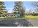 Aspen Grove community sign surrounded by trees and green lawn at 2800 Kalmia Ave # C101, Boulder, CO 80301