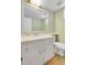 Bathroom with a sink, toilet and large mirror at 3575 S Waco St, Aurora, CO 80013