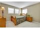 Bedroom with neutral walls and carpet, natural lighting, and furniture at 3575 S Waco St, Aurora, CO 80013