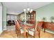Elegant dining room featuring a classic wooden table, chairs, and a stylish chandelier for Gathering gatherings at 3575 S Waco St, Aurora, CO 80013
