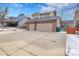 Residential two-story home with an attached two-car garage and a large driveway on a partly cloudy day at 3575 S Waco St, Aurora, CO 80013