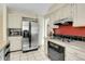 The kitchen has tile floors and stainless steel refrigerator at 3575 S Waco St, Aurora, CO 80013