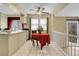 Bright kitchen with a ceiling fan and adjacent dining area with a red tablecloth at 3575 S Waco St, Aurora, CO 80013