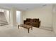 Cozy basement living room with neutral carpet and a large couch at 3575 S Waco St, Aurora, CO 80013