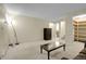 View of the basement living room leading to a bathroom and storage at 3575 S Waco St, Aurora, CO 80013