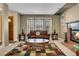 Bright living room with a fireplace, comfortable seating, and large windows that add natural light at 3575 S Waco St, Aurora, CO 80013