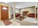 Cozy living room with a fireplace, comfortable seating, and large windows letting in natural light at 3575 S Waco St, Aurora, CO 80013