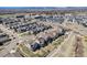 Expansive aerial view of a well-planned community featuring manicured lawns and tree-lined streets at 7121 W Asbury Pl, Lakewood, CO 80227