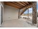 Back patio with stone pillars that provides an ideal spot for outdoor enjoyment at 7121 W Asbury Pl, Lakewood, CO 80227