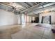 Unfinished basement with high ceilings, large windows, and potential for customization at 7121 W Asbury Pl, Lakewood, CO 80227